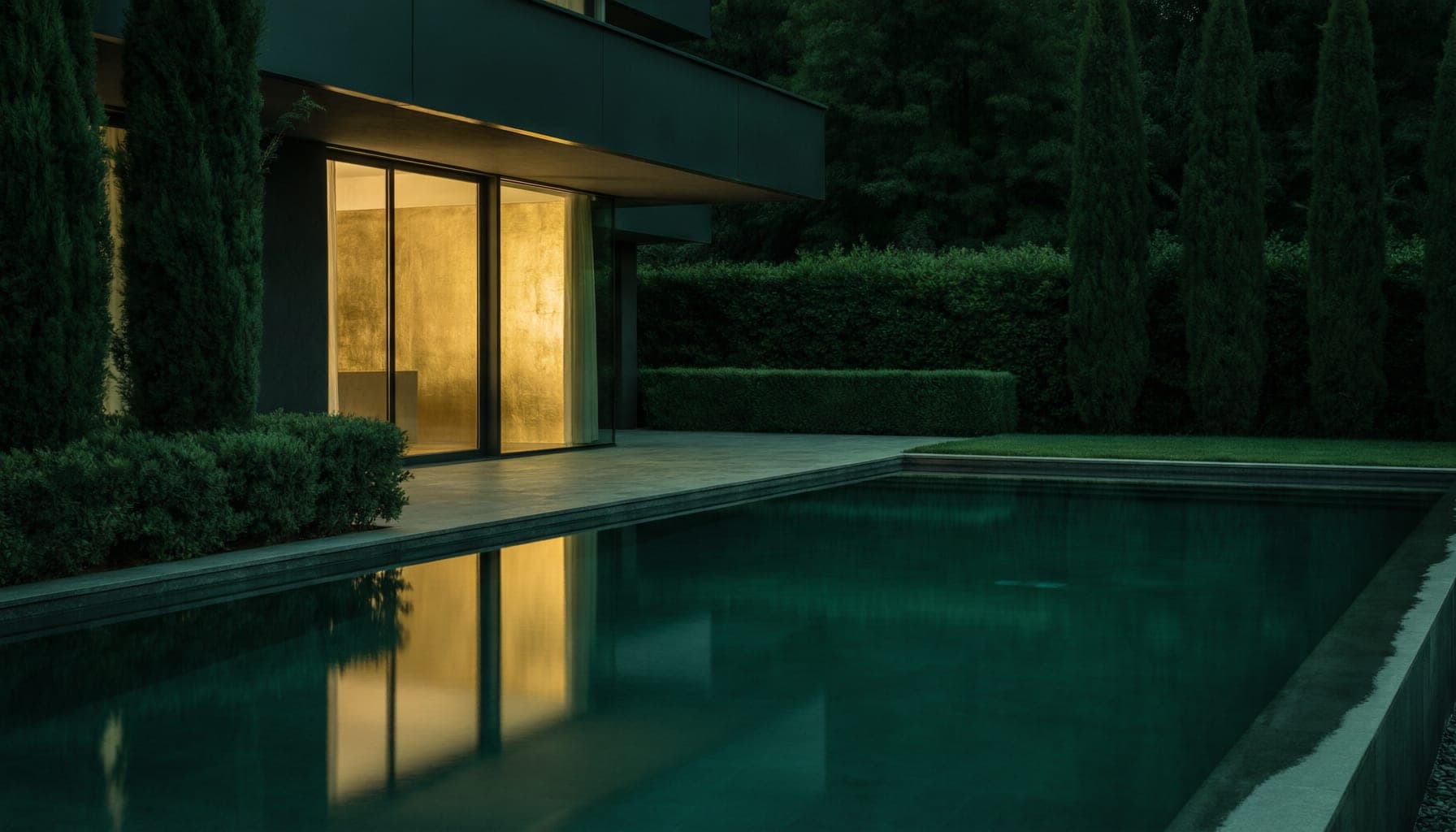 Luxury pool and villa at night